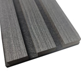 Close-up of real wood charcoal slats in wall panel
