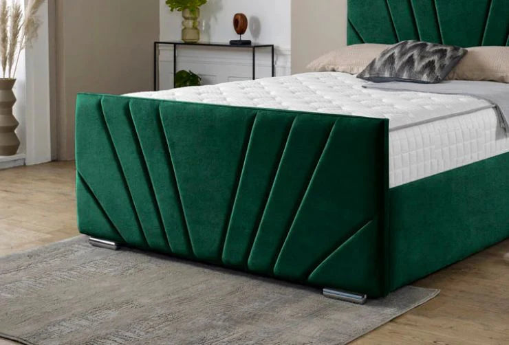 Green bed frame with white mattress in a room setting