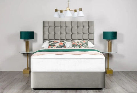 Bedroom setup with a bed, headboard, and side tables.