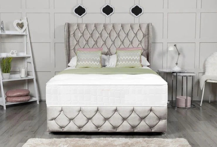 Bedroom with a tufted bed and decorative headboard